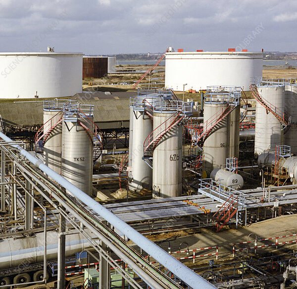 ^BChemical plant storage tanks.^b The industrial-scale manufacture of chemicals requires specialised engineering to meet a wide range of storage requirements. Products and reactants, ranging from liquids to gases and solids, have to be kept at the correct temperature and pressure. They then need to be piped or transported around the site to and from these storage facilities. These tanks are part of a larger oil refinery and chemical manufacturing site. Oil refining and chemical manufacturing are closely related industries, as oil products are used in a wide range of chemical industry manufacturing processes. Photographed at ExxonMobil's Fawley Oil Refinery and Chemical Plant, Hampshire, UK, which is one of the largest petrochemical plants in Europe.
